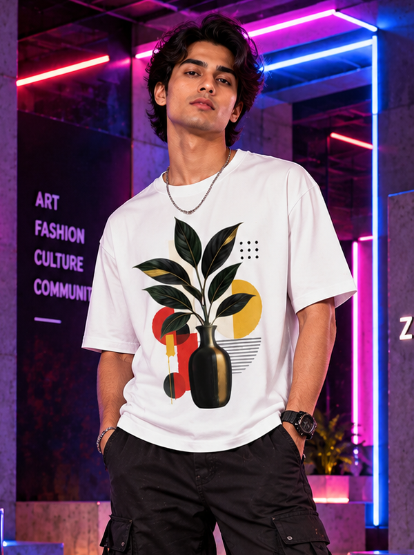 Man wearing Zingleberry Botanical Abstract Art white oversized T-shirt styled with black cargo pants and boots.