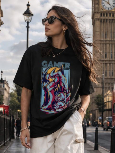 Female model wearing Zingleberry Gamer Premium Unisex Black Cotton T-Shirt featuring a vibrant gaming graphic print, styled with white cargo pants for modern summer streetwear in London.
