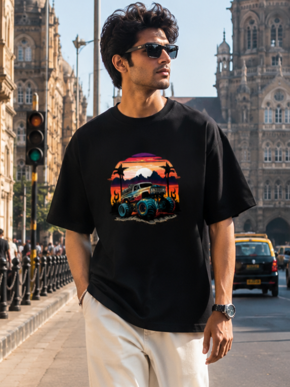 Male model wearing Zingleberry Premium Unisex Classic Crew Off-Road Sunset black graphic T-shirt with white trousers in a premium urban streetwear photoshoot.
