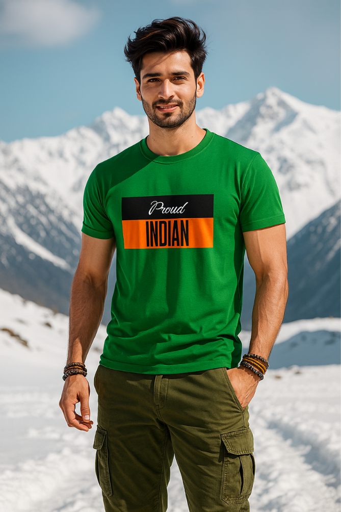 Male model in snow-capped mountains wearing Zingleberry green patriotic T-shirt with “Proud Indian” print, styled with olive green cargo pants
