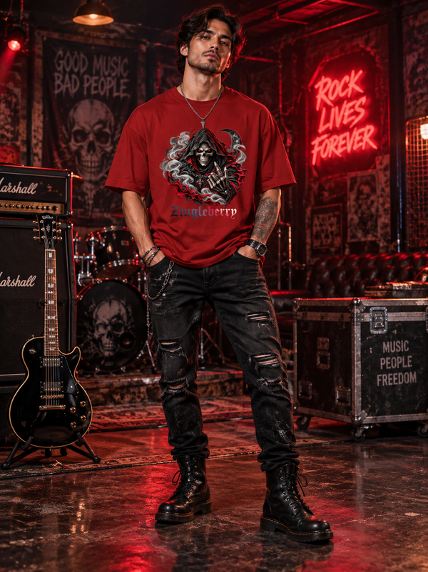 Male model wearing Zingleberry Reaper Rock red oversized graphic T-shirt with distressed black jeans and combat boots in rock music studio.