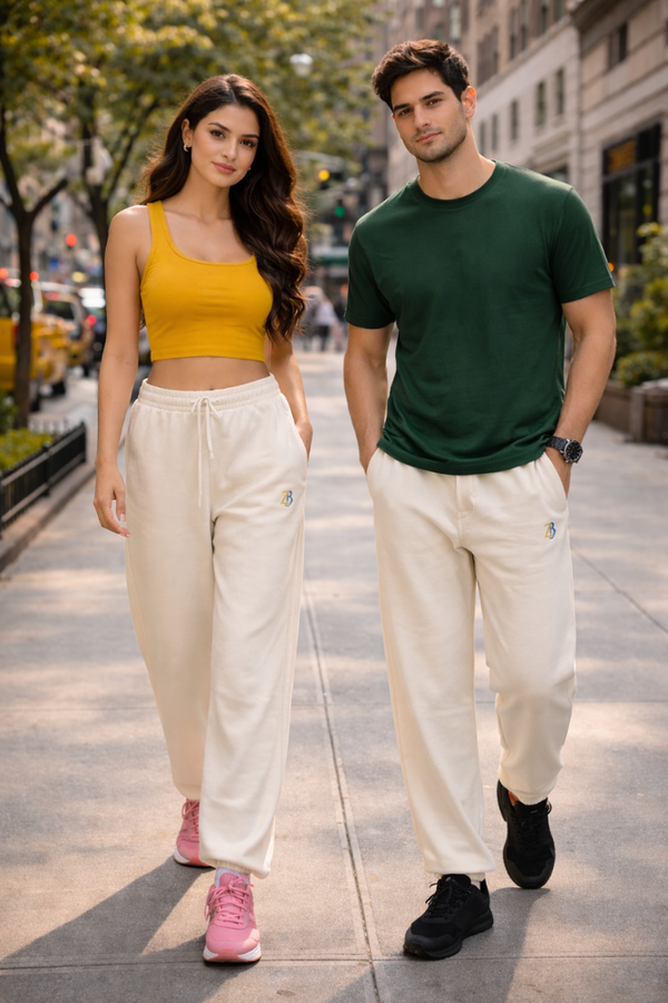 Indian male and female models wearing Zingleberry premium unisex off white sweatpants, styled for everyday street fashion with casual t-shirts and sneakers.