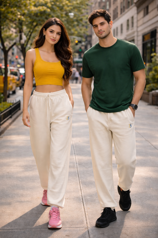 Indian male and female models wearing Zingleberry premium unisex off white sweatpants, styled for everyday street fashion with casual t-shirts and sneakers.