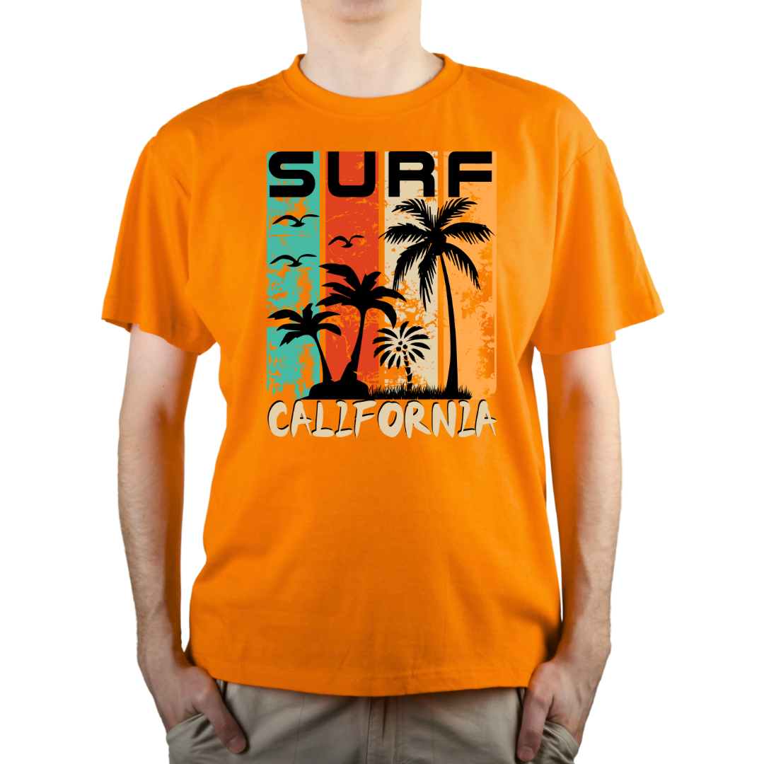 Male model wearing an orange 'Surf California' printed T-shirt showcasing a colourful tropical beach scene with palm trees and birds.
