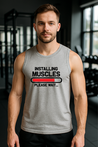 Man wearing grey sleeveless Zingleberry gym t-shirt with “Installing Muscles” print, ideal for gym lovers and fitness training.