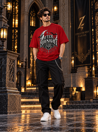Male model wearing Zingleberry After Midnight Club red oversized Gothic T-shirt with black cargo trousers