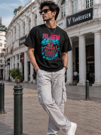 Male model wearing Zingleberry Alien Premium Black Cotton Graphic T-Shirt paired with white cargo trousers for a modern urban streetwear look.