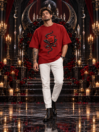 Male model wearing Zingleberry Crimson Thorn red oversized Gothic T-shirt with rose and thorn artwork.