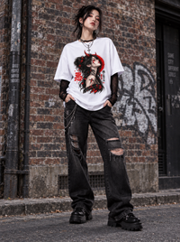 Female model wearing Zingleberry Dark Oni Girl white oversized 100% cotton graphic T-shirt with black distressed jeans and alternative streetwear styling.