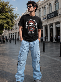 Male model wearing Zingleberry Enjoy The Moment Panda Premium Black Cotton Graphic T-Shirt paired with light blue cargo pants for a stylish casual streetwear look.