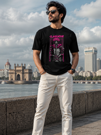 Male model wearing Zingleberry Gladiator Premium Black Cotton Graphic T-Shirt styled with white trousers for modern casual streetwear fashion.