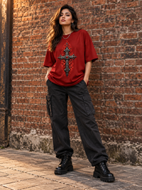 Female model wearing Zingleberry Inferno Cross red oversized Gothic T-shirt with black cargo trousers and combat boots.