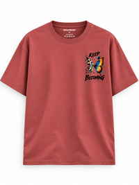 Zingleberry brick-red Keep Becoming unisex oversized T-shirt with butterfly graphic on left chest.