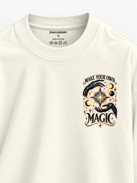 Zingleberry Make Your Own Magic off-white oversized T-shirt with celestial mystical left-chest graphic.