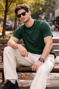 Male model wearing Zingleberry premium unisex off white sweatpants with green t-shirt, showcasing relaxed fit and everyday comfort.