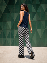 Zingleberry Moonlit Muse navy blue women’s cotton tank top plain back view styled with black and white checkerboard trousers