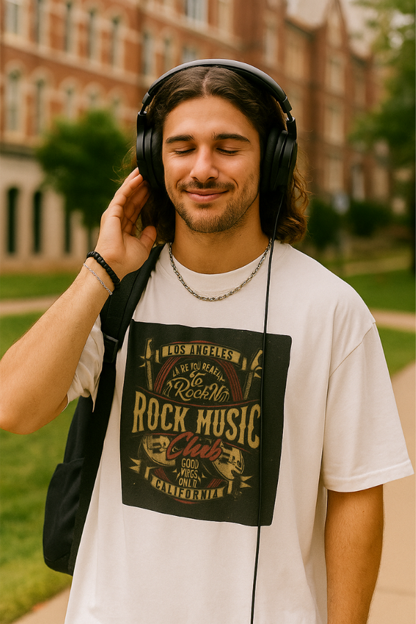 Young man wearing white Zingleberry Rock Music Club unisex oversized t-shirt with vintage California design and headphones – music-themed casual streetwear