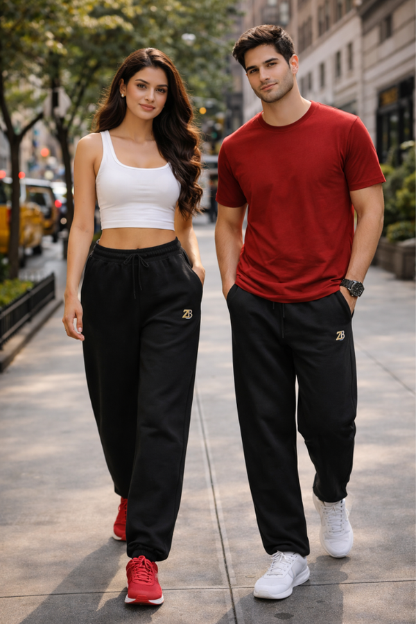 Indian male and female models wearing Zingleberry premium unisex black sweatpants, styled for modern streetwear and everyday fashion.