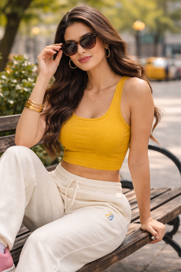 Female model wearing Zingleberry premium unisex off white sweatpants with crop top, styled for casual outdoor wear and relaxed comfort.