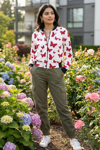 Zingleberry Premium Women’s white bomber jacket with red butterfly all-over print, front view, stylish winter streetwear