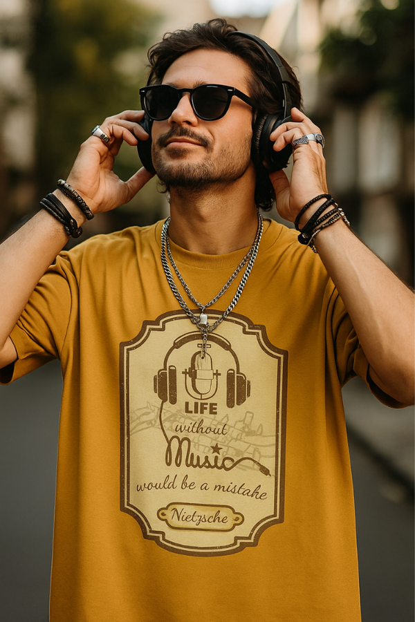 Male wearing Zingleberry's unisex oversized white t-shirt with life without music -themed art print, smiling with headphones and enjoying the music.